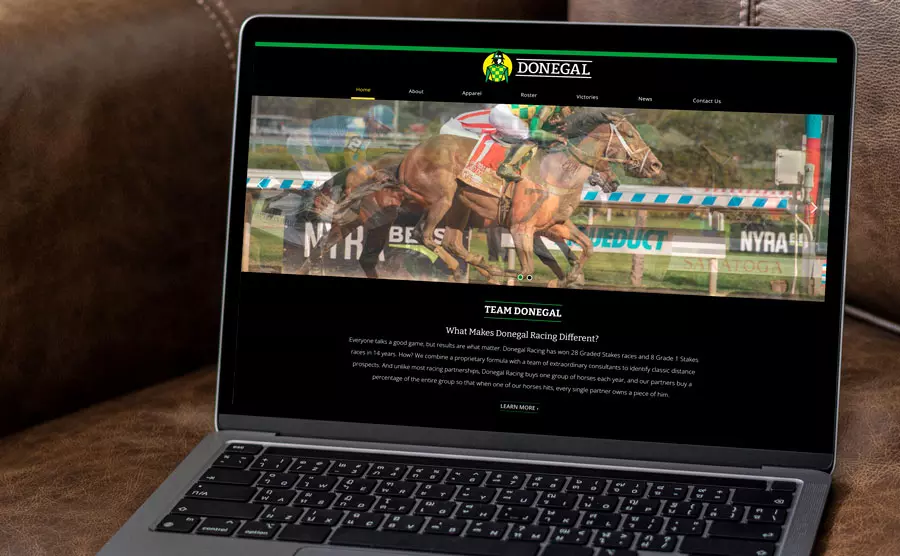 Laptop view of Donegal Racing's website designed by Global Reach, one of the best sports industry web designers in Iowa and the midwest.